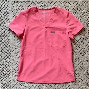 Neon pink FIGS scrub top